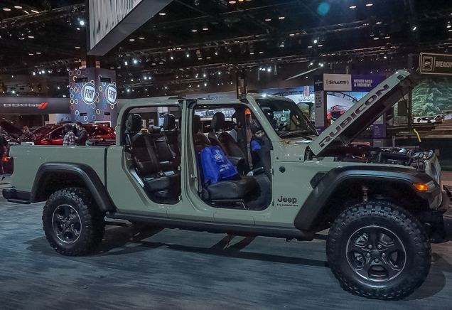 You want CAS summed up in one photo? Two little kids clamoring all over the new Jeep Gladiator while their parents watch.